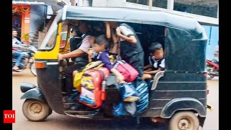 Black and yellow auto-rickshaw overflowing with schoolchildren and bags spilling out of the open sides